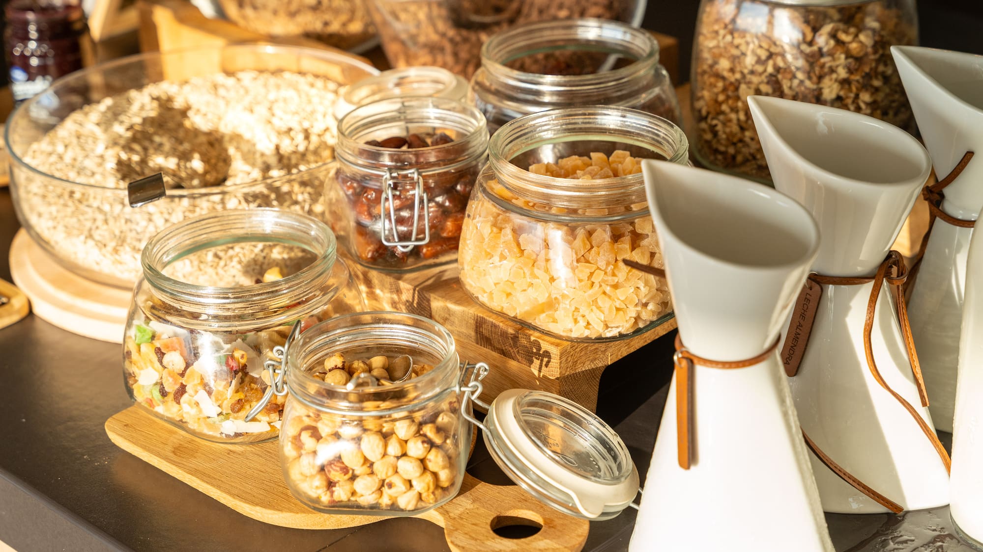 a group of glass jars with food in them