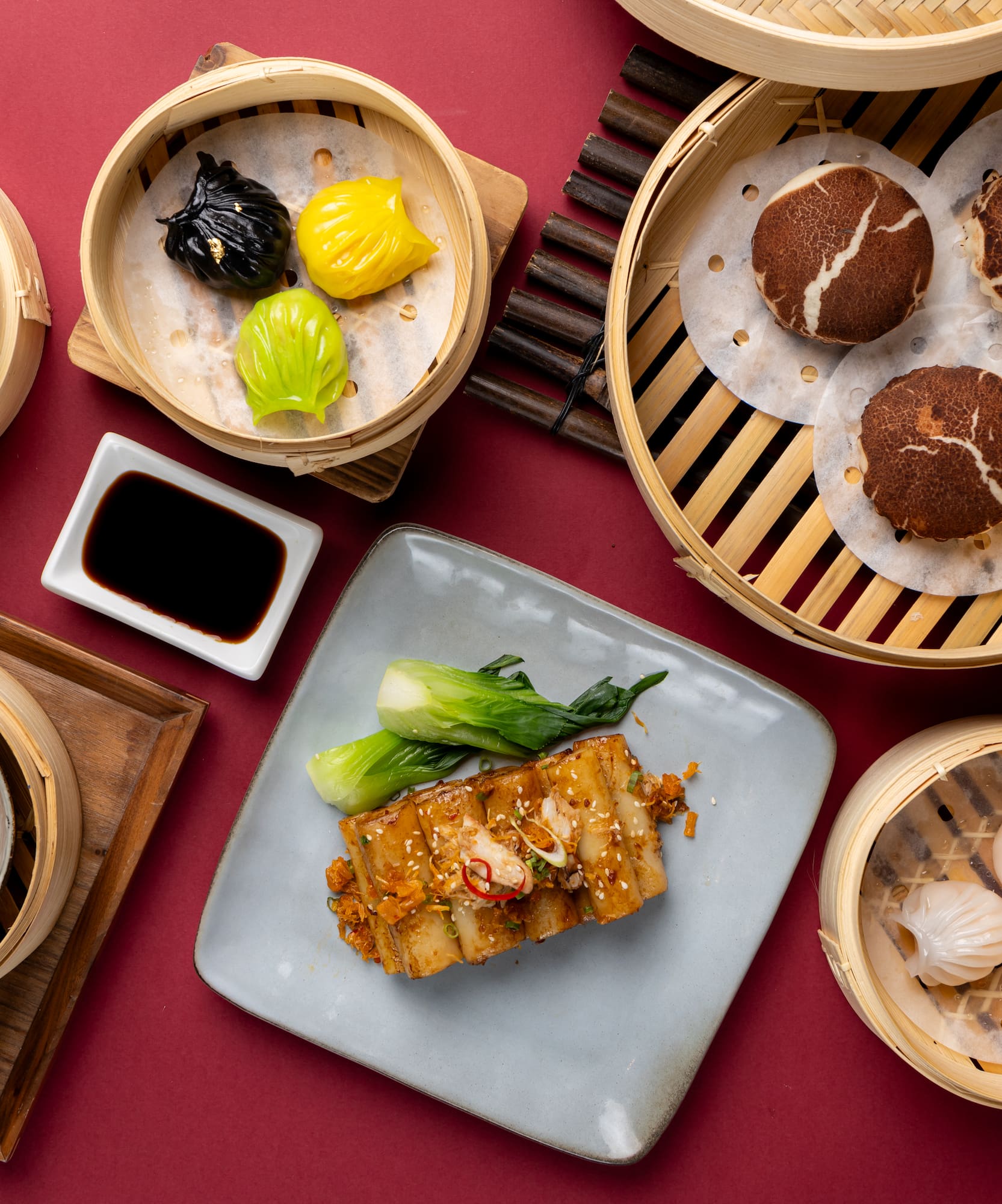 a group of dim sum baskets with food in them