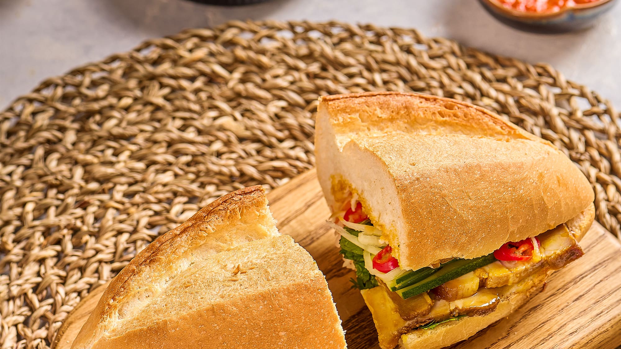 a sandwich cut in half on a cutting board