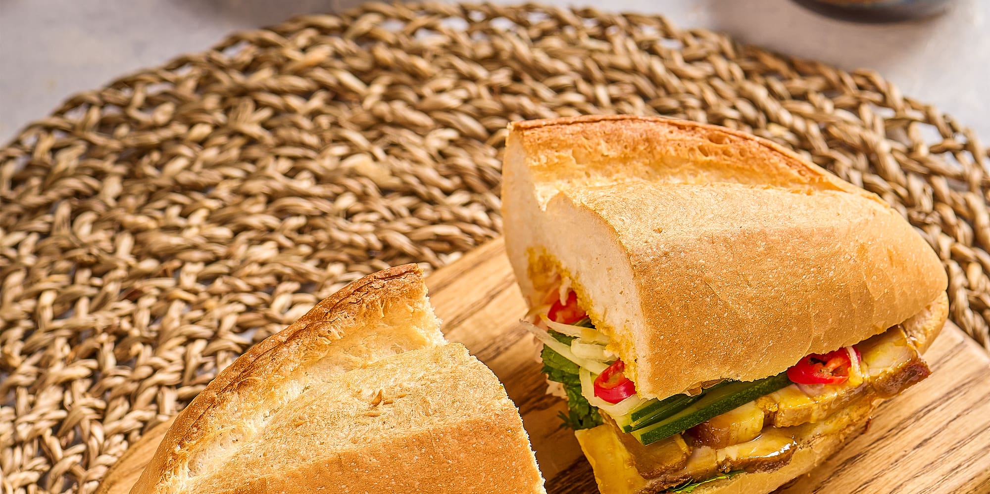 a sandwich cut in half on a cutting board