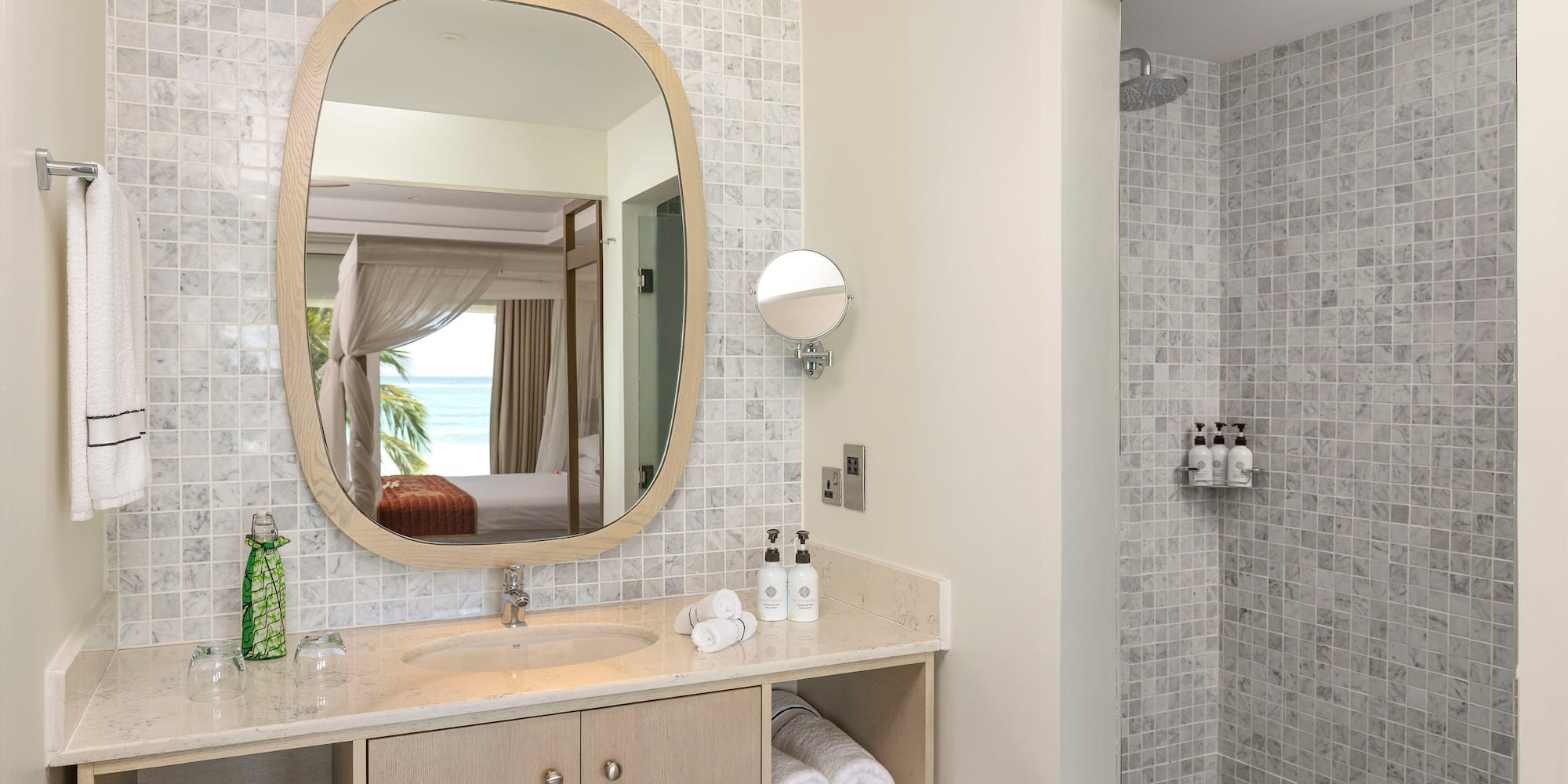 a bathroom with a mirror and a shower