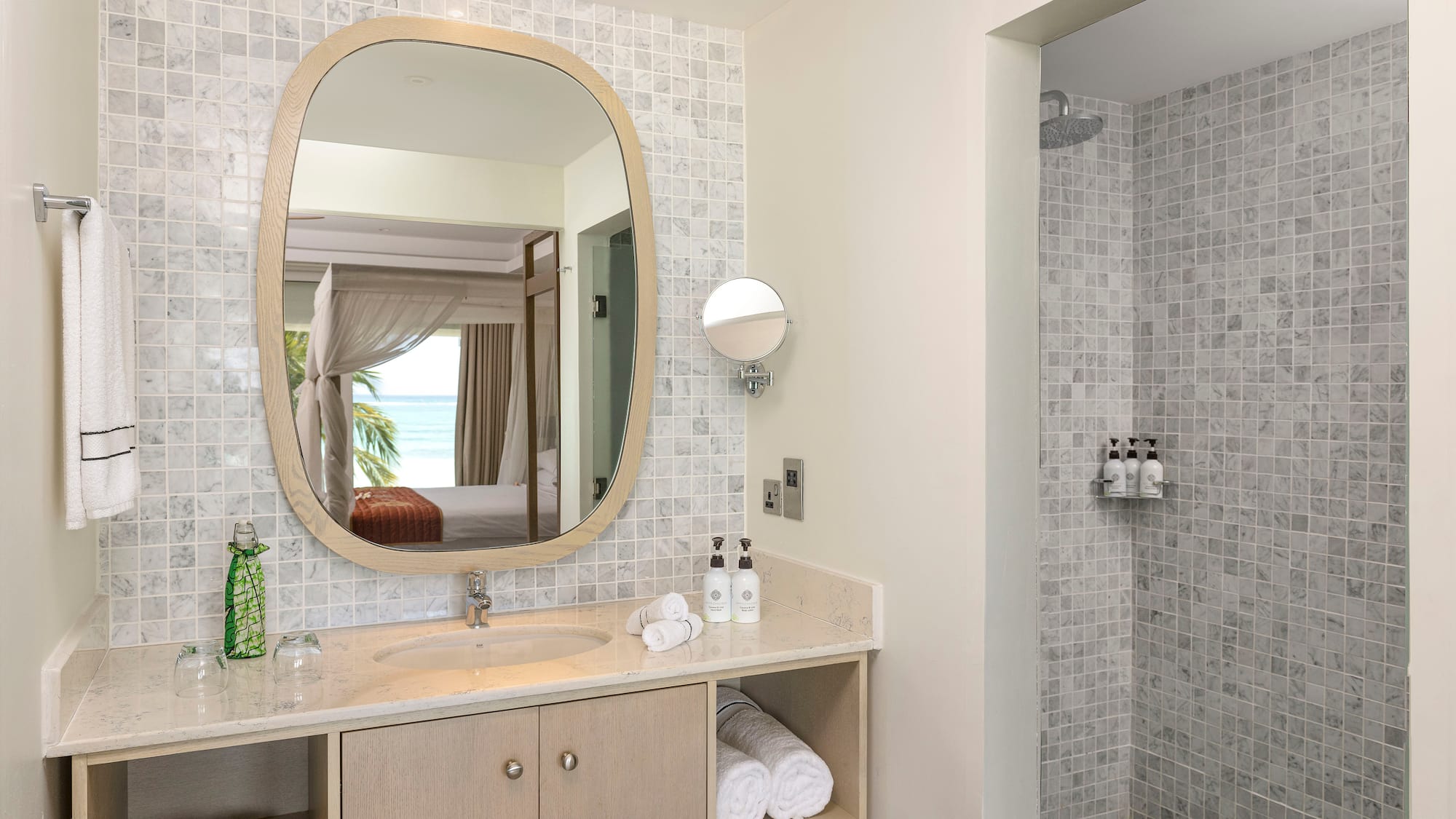 a bathroom with a mirror and a shower