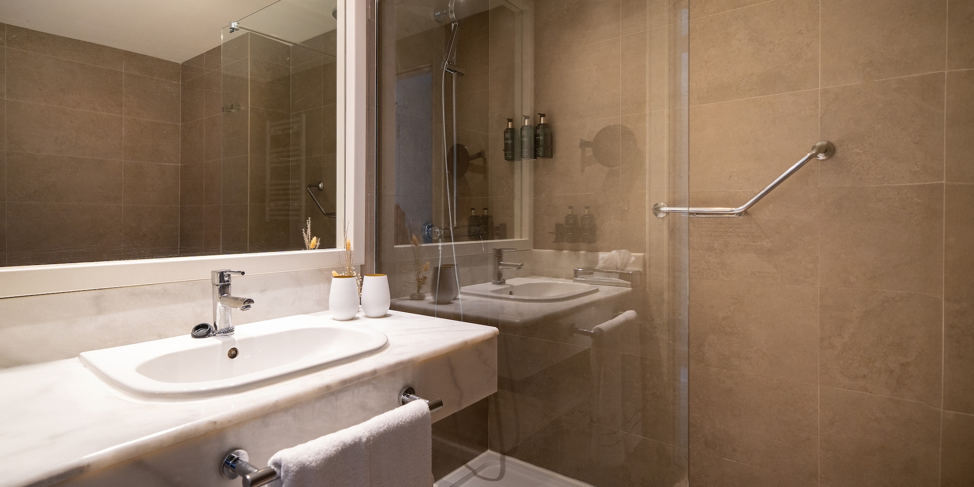 a bathroom with a shower and sink