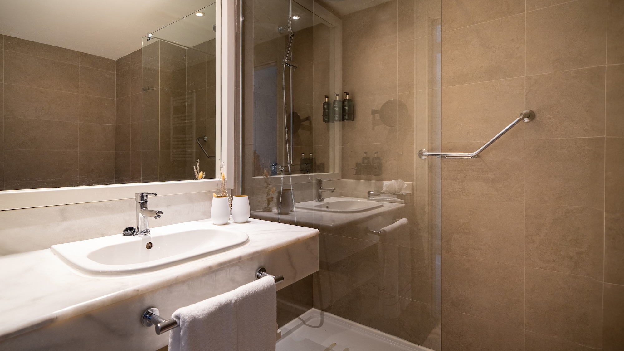 a bathroom with a shower and sink