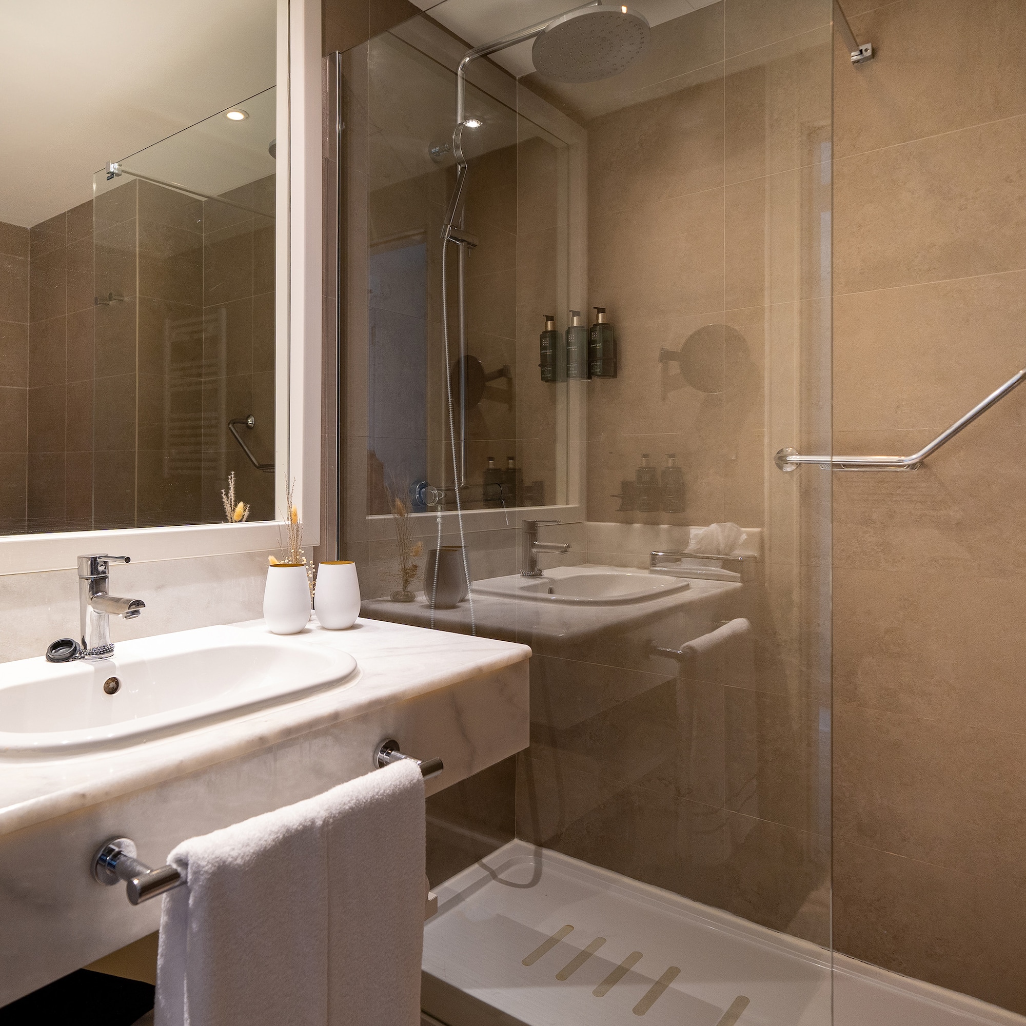 a bathroom with a shower and sink