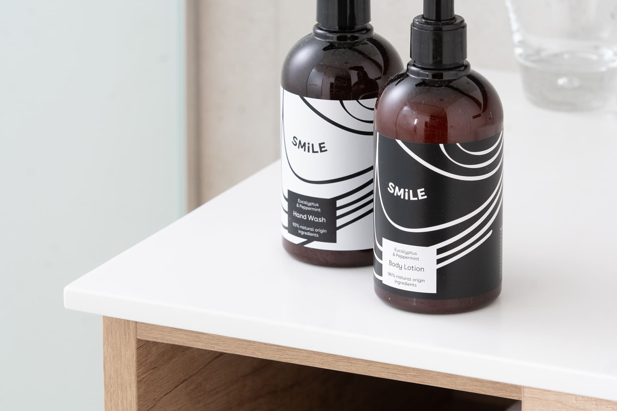 SMILE eucalyptus peppermint hand wash & body lotion on bathroom vanity.