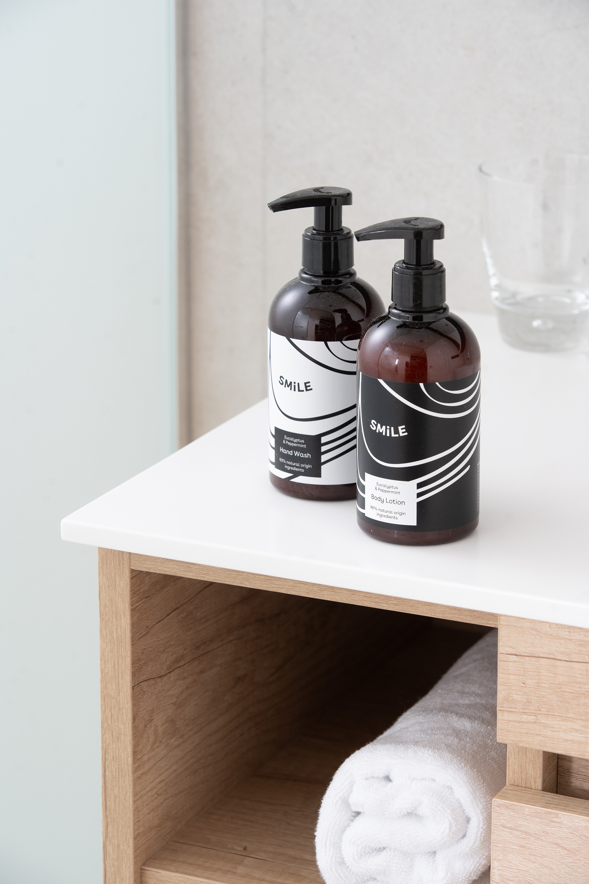SMILE eucalyptus peppermint hand wash & body lotion on bathroom vanity.