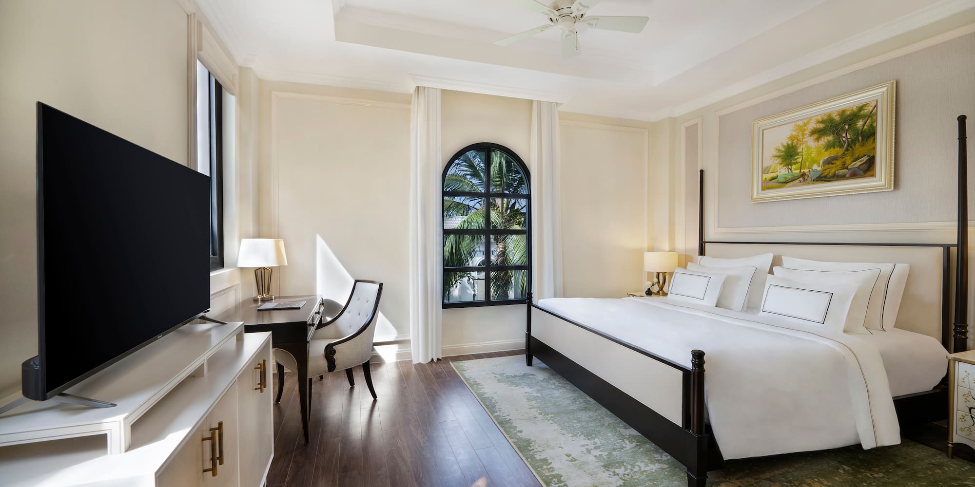 a room with a bed and a tv