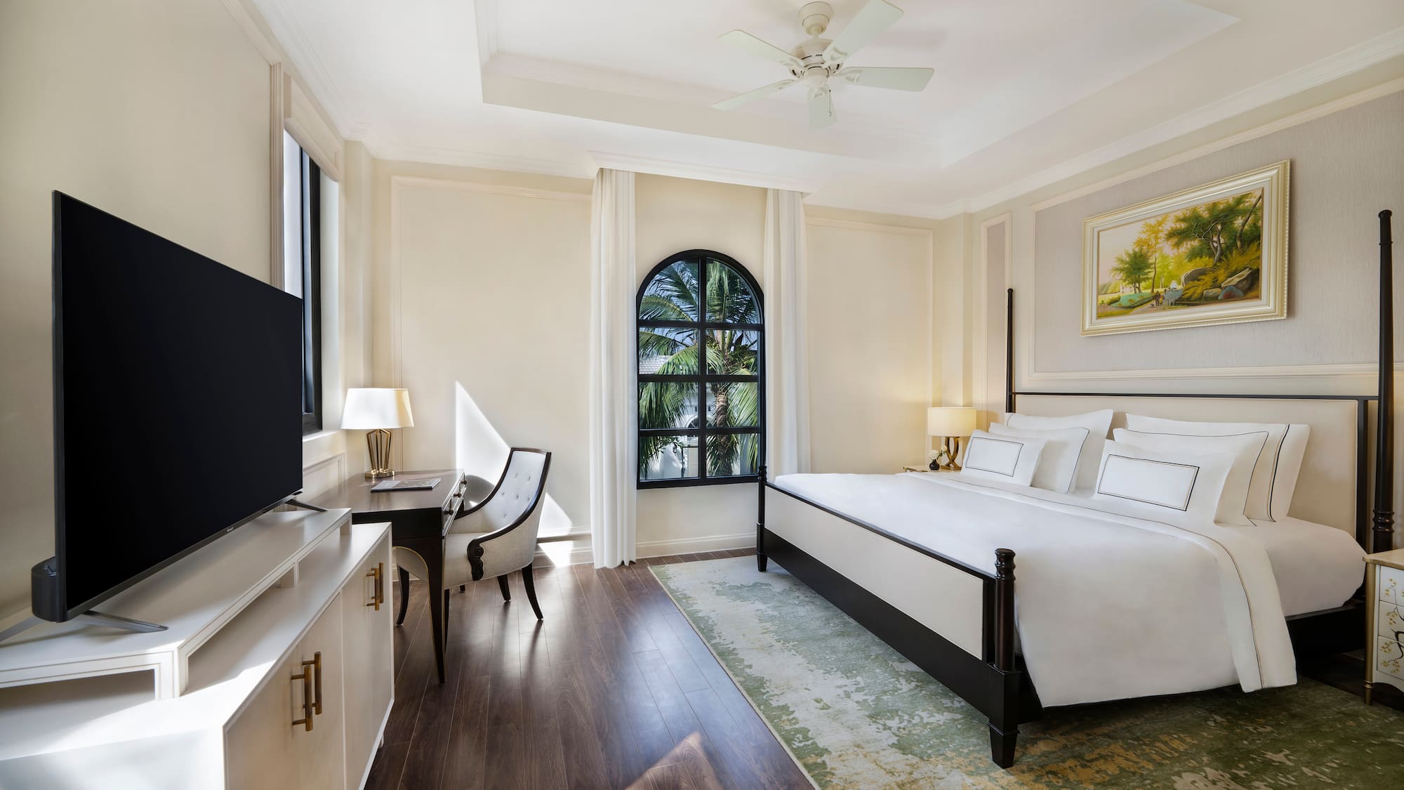 a room with a bed and a tv