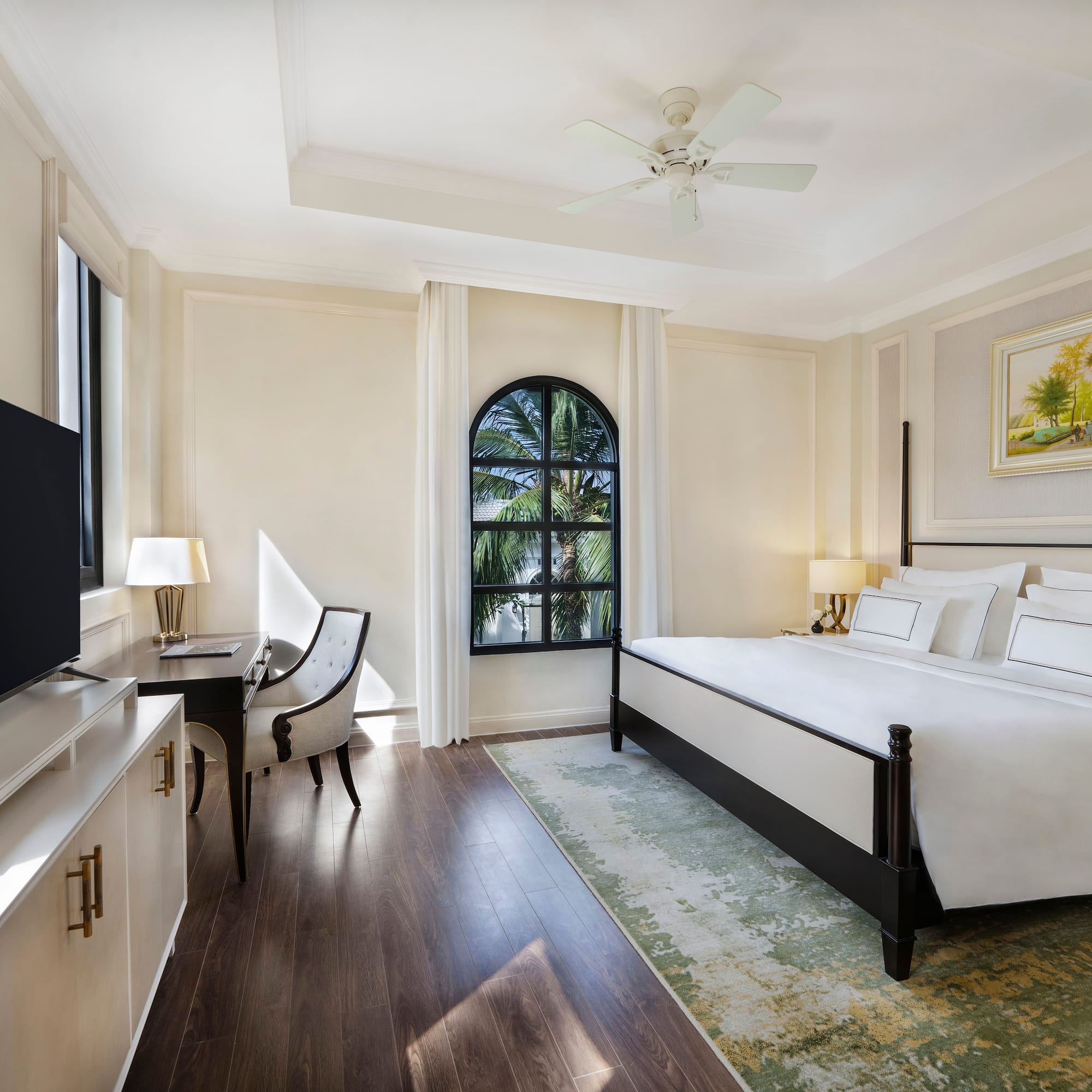 a room with a bed and a tv