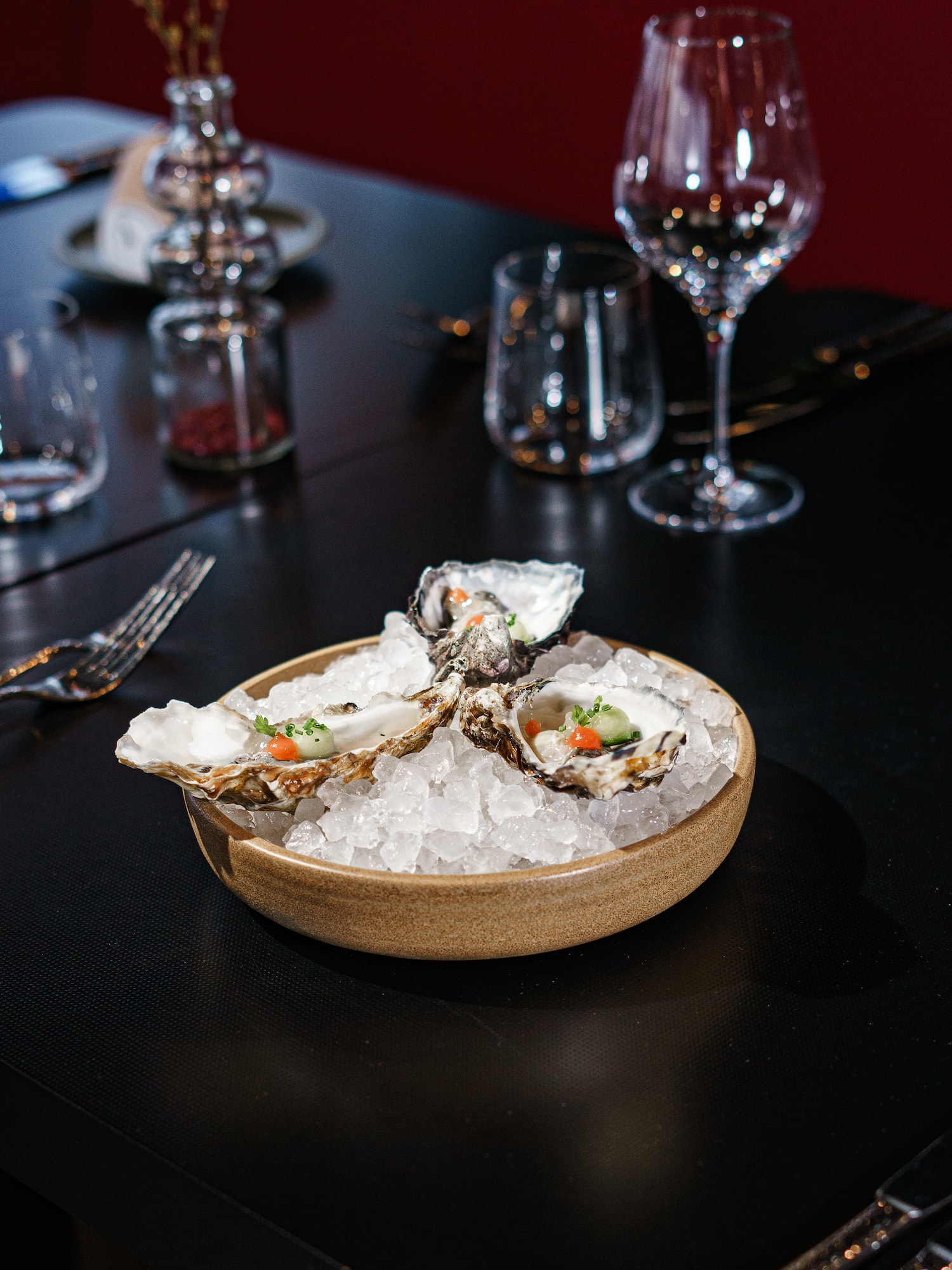a bowl of oysters on ice