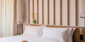 a bed with a hat on it