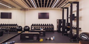 a gym with weights and equipment