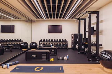 a gym with weights and equipment