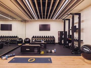 a gym with weights and equipment
