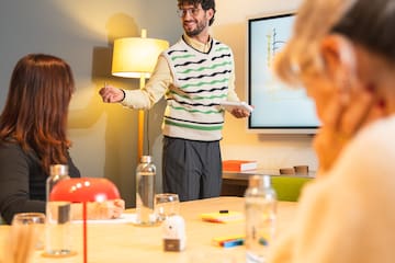 a man standing in front of a group of people