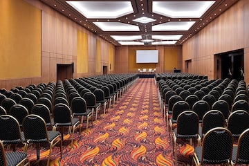 a room with many chairs and a stage