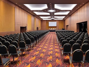 a room with many chairs and a stage