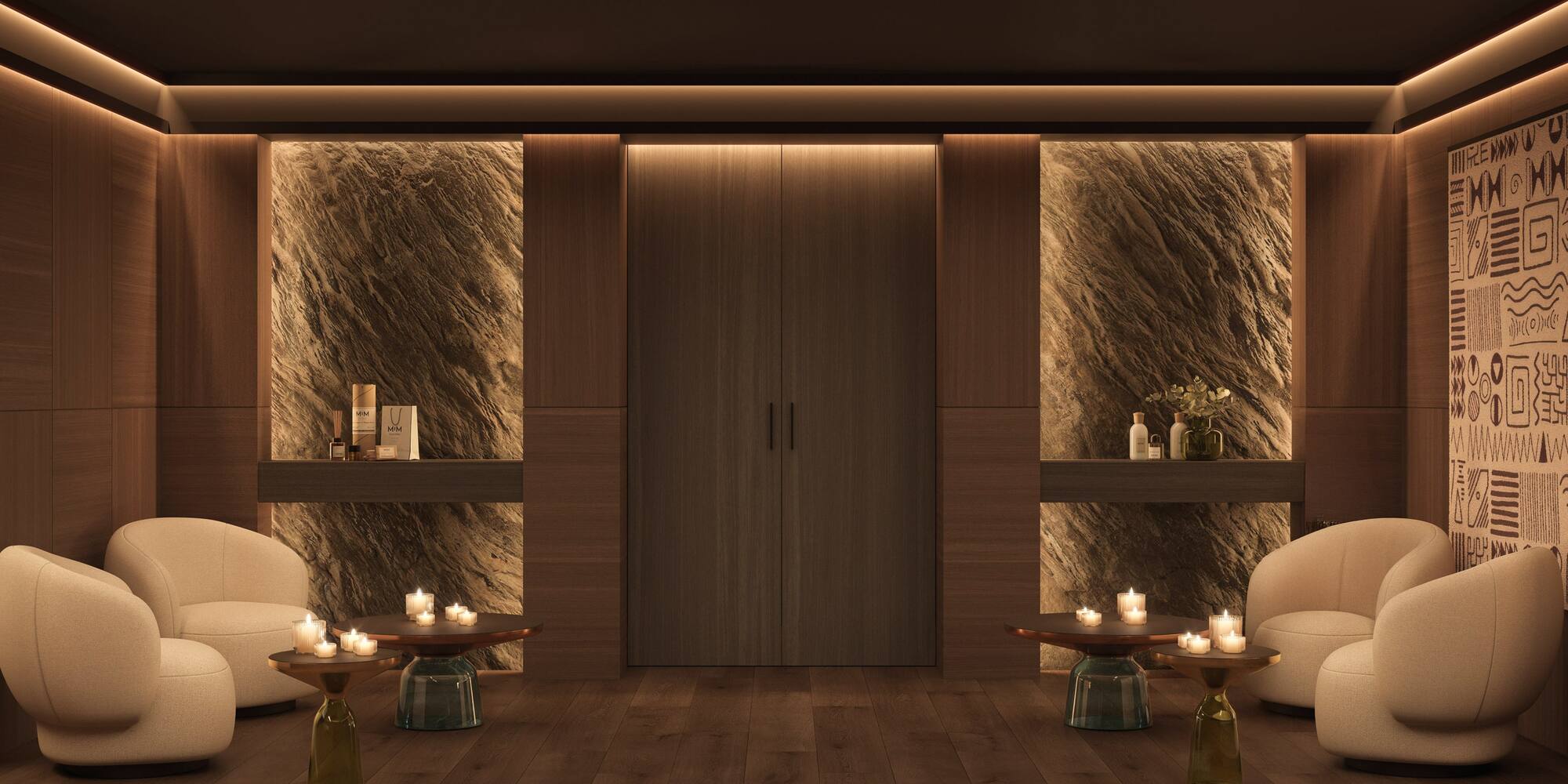 a room with a couple of chairs and a table with candles