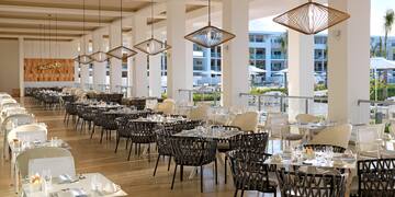 a restaurant with tables and chairs