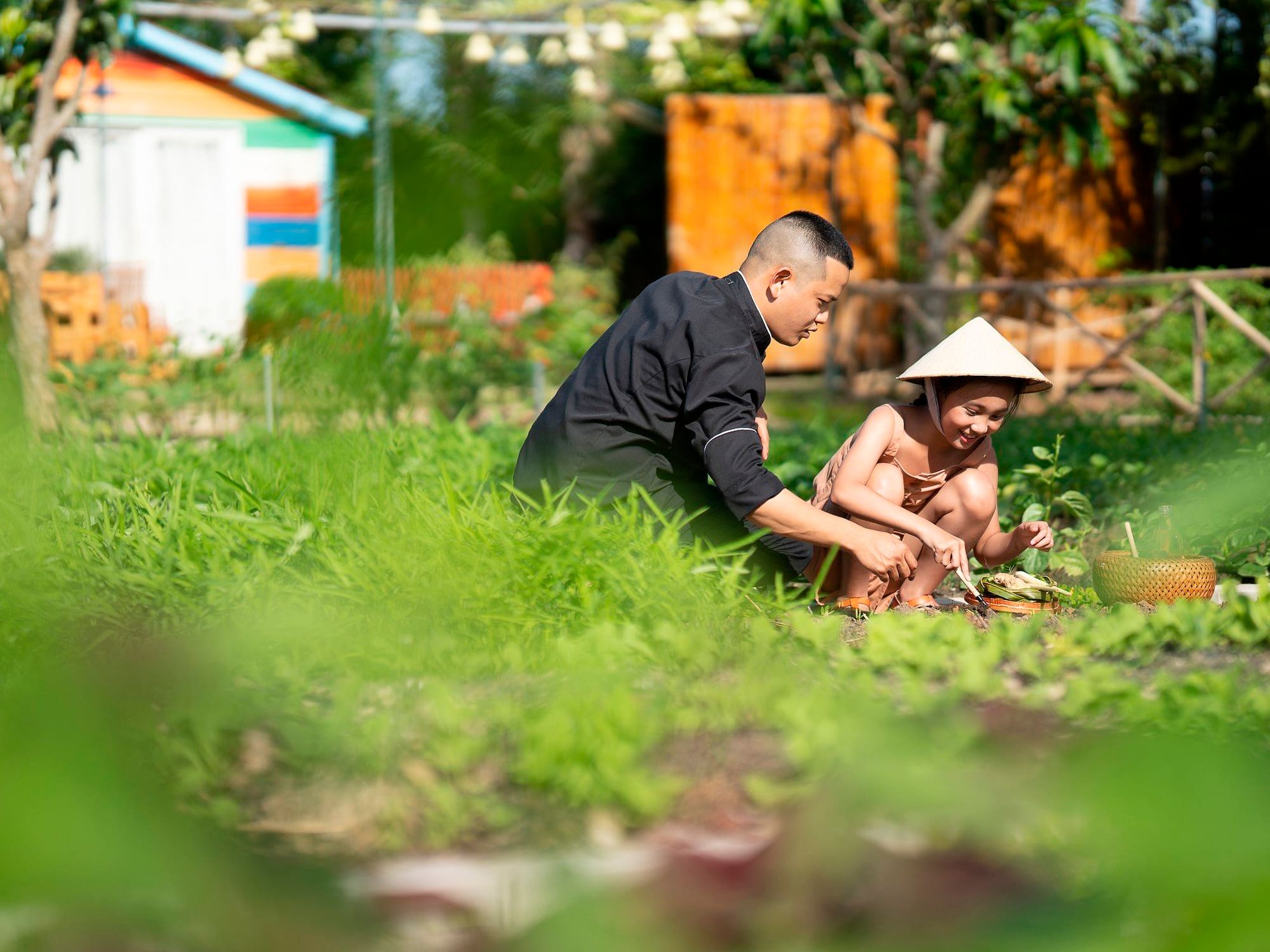 a man and child in a garden