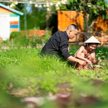 a man and child in a garden