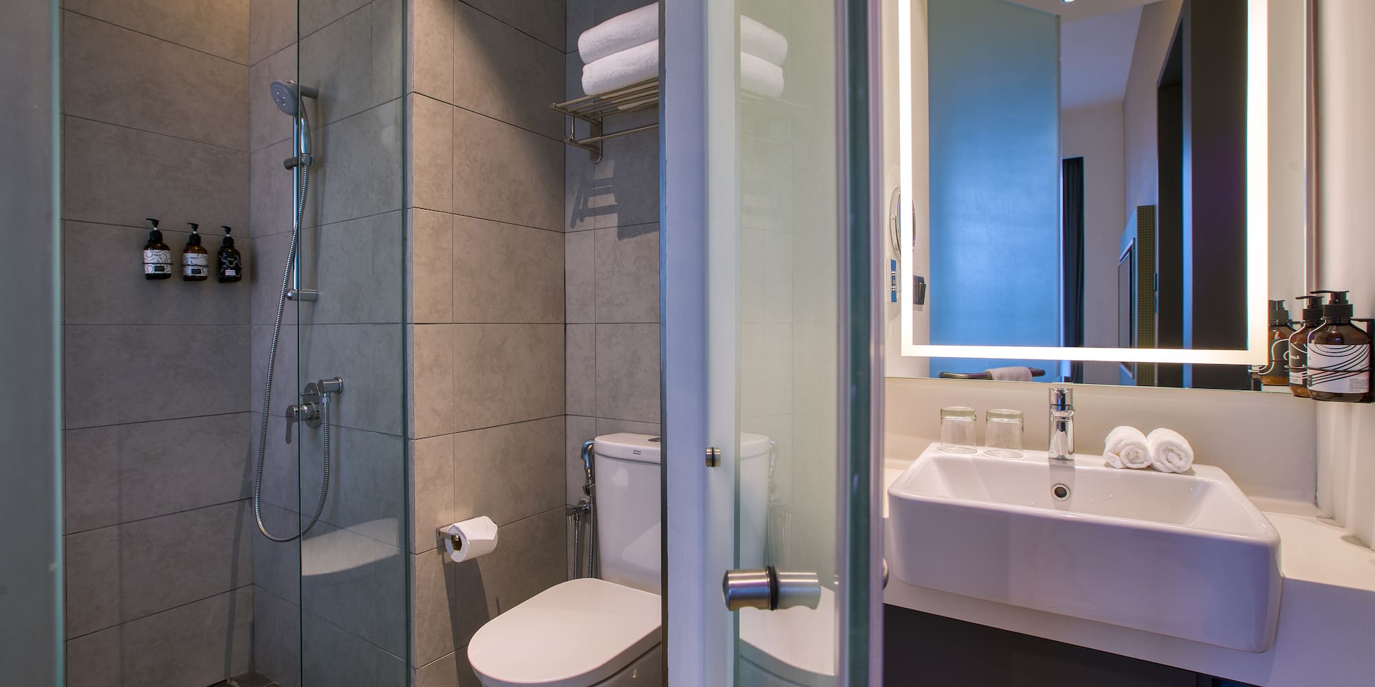 a bathroom with a shower and toilet