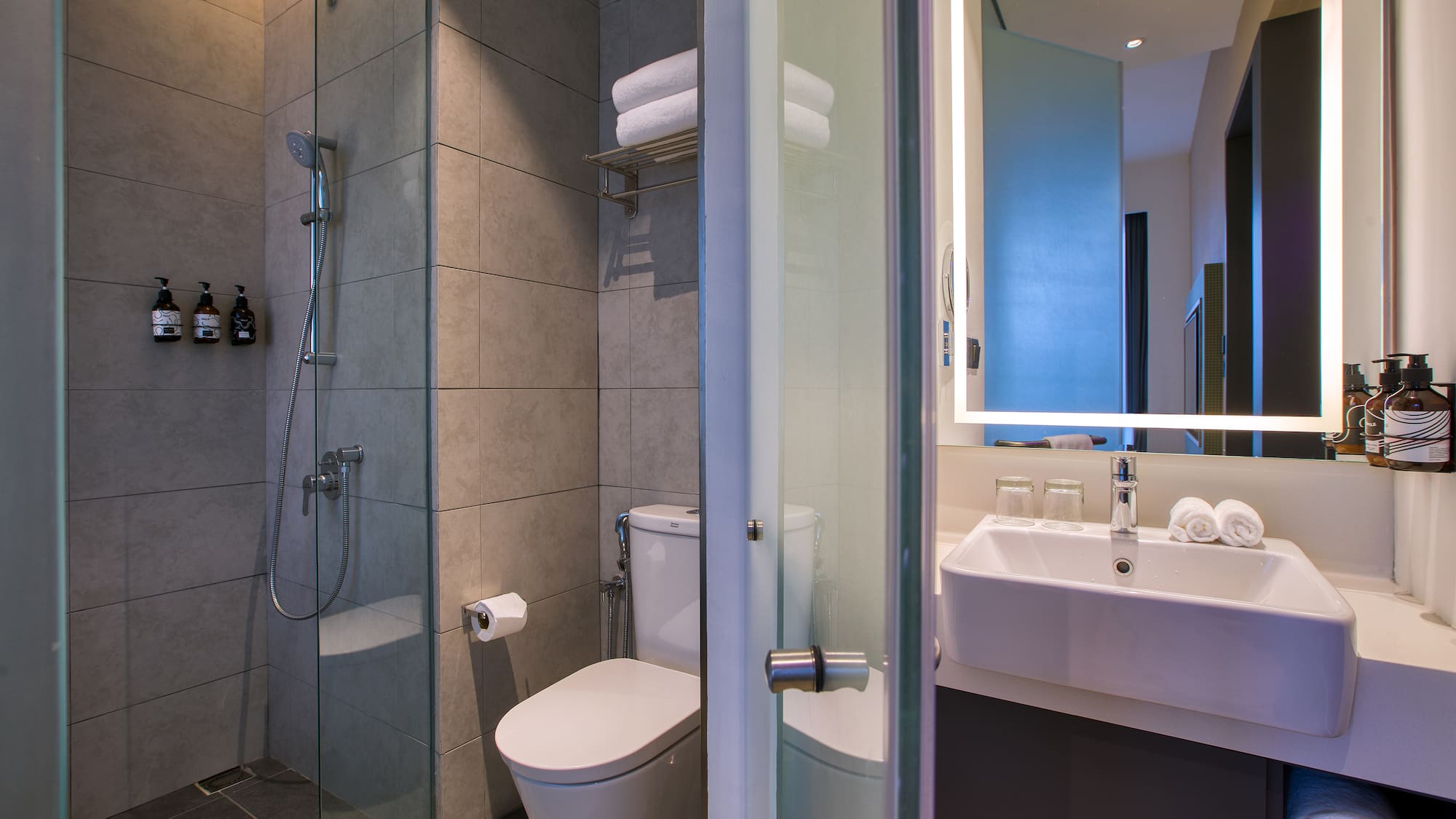 a bathroom with a shower and toilet
