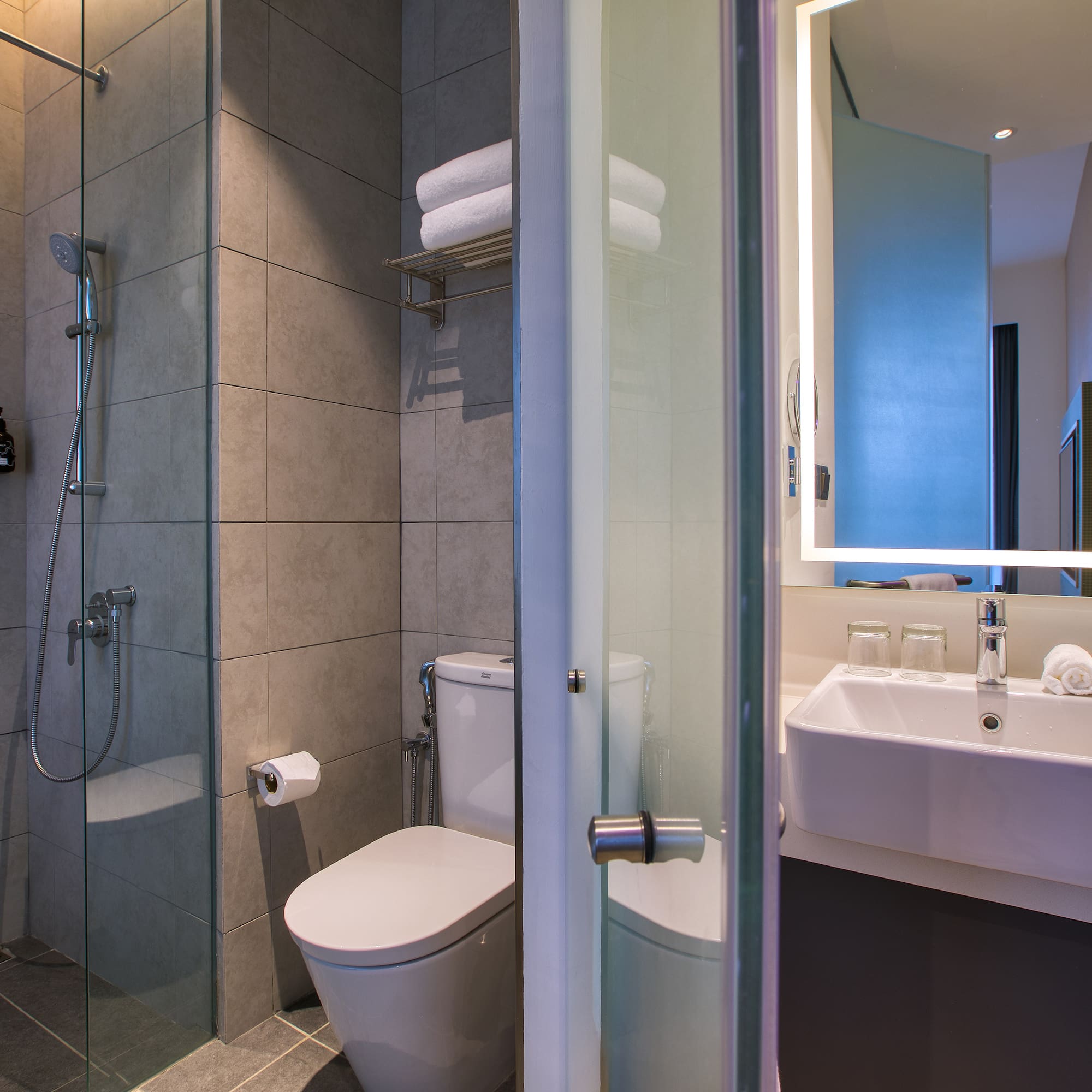 a bathroom with a shower and toilet