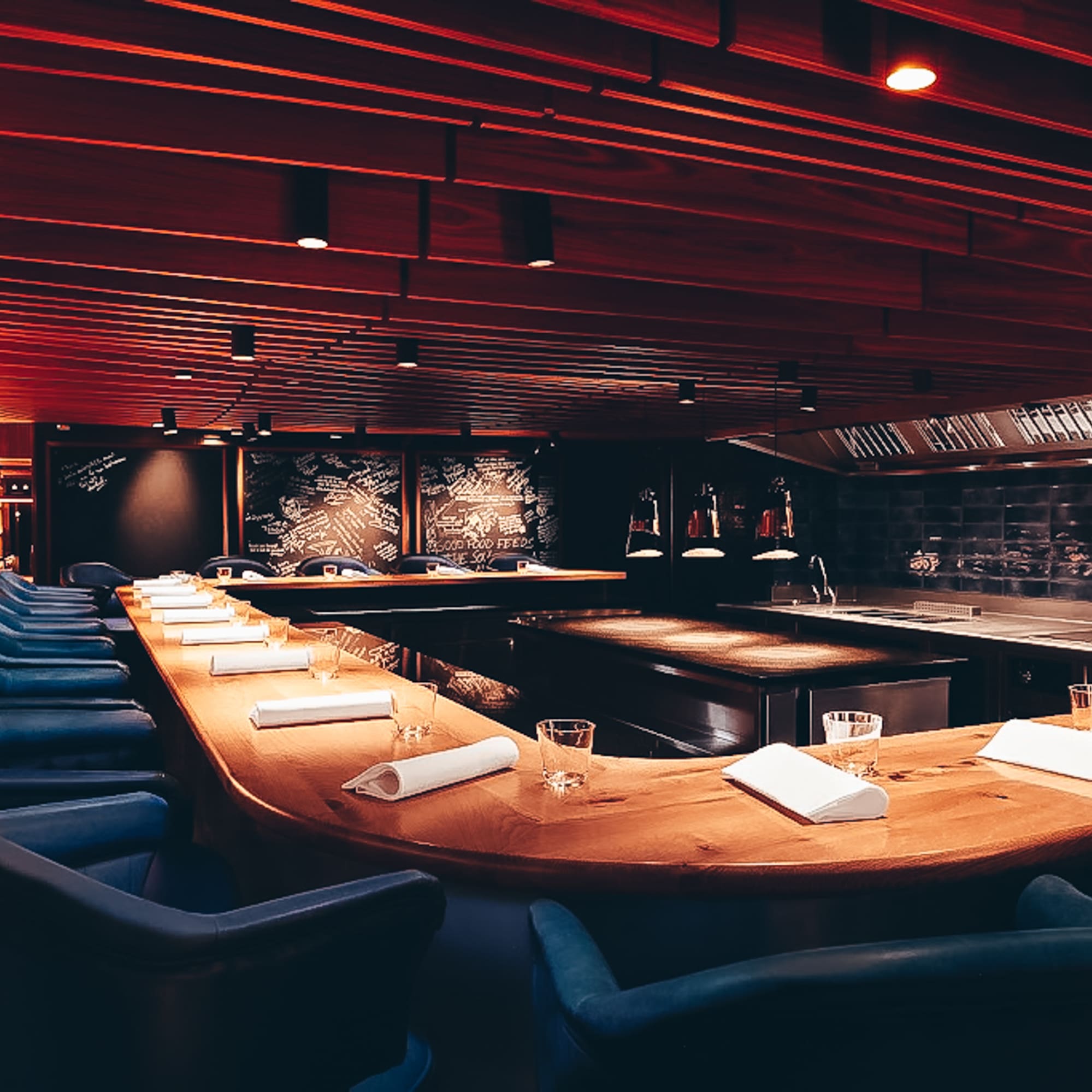 a room with a long table and chairs