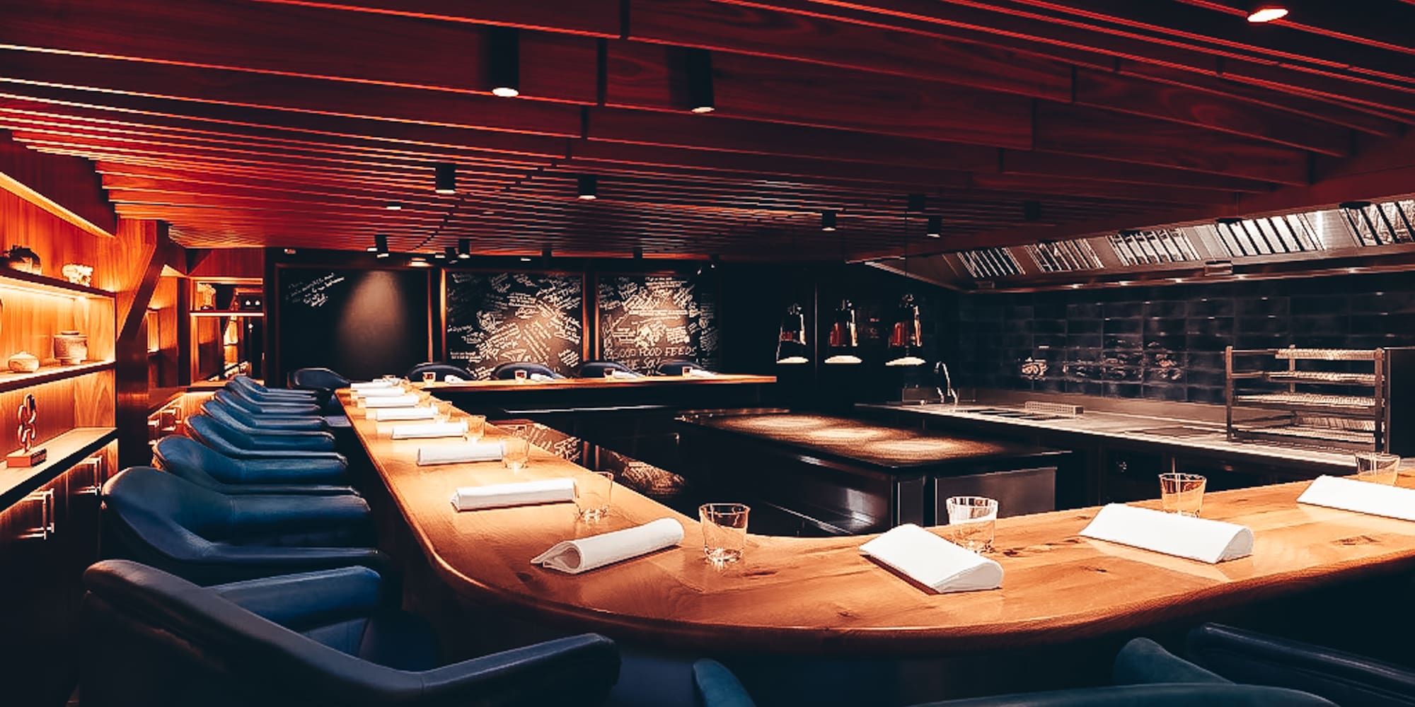 a room with a long table and chairs