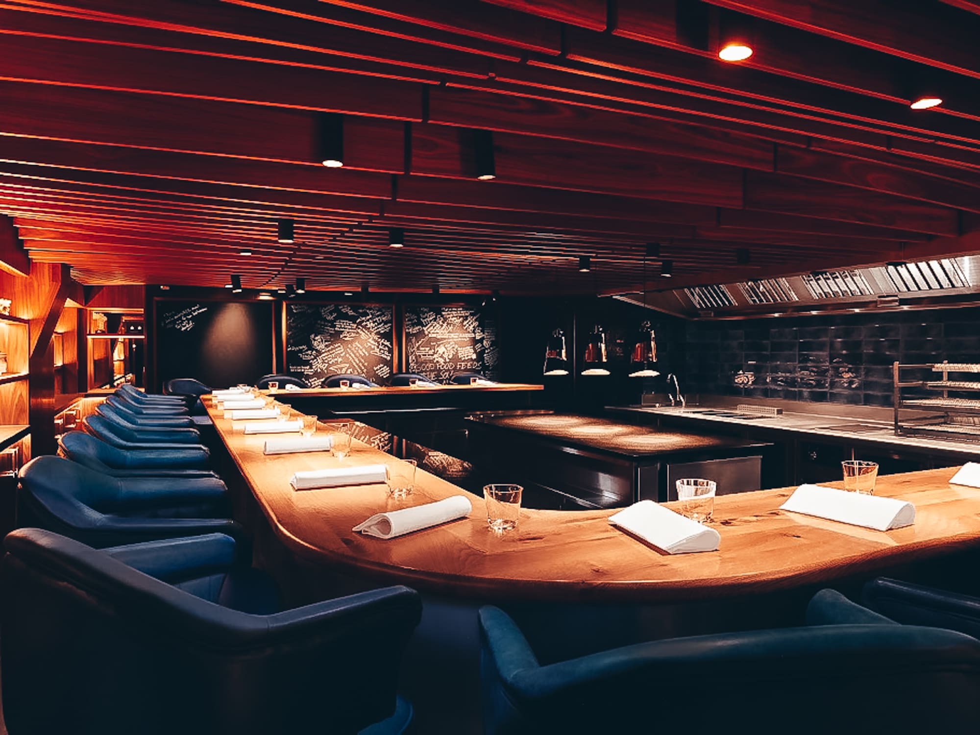 a room with a long table and chairs