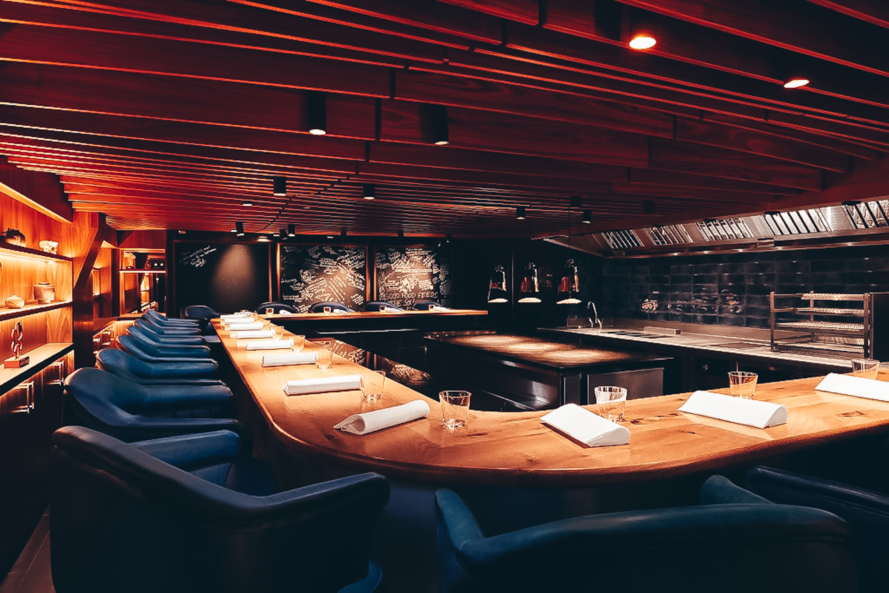 a room with a long table and chairs