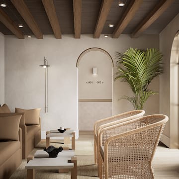 a room with a couch and chairs