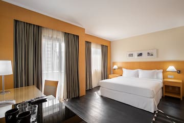 a room with a bed and a desk