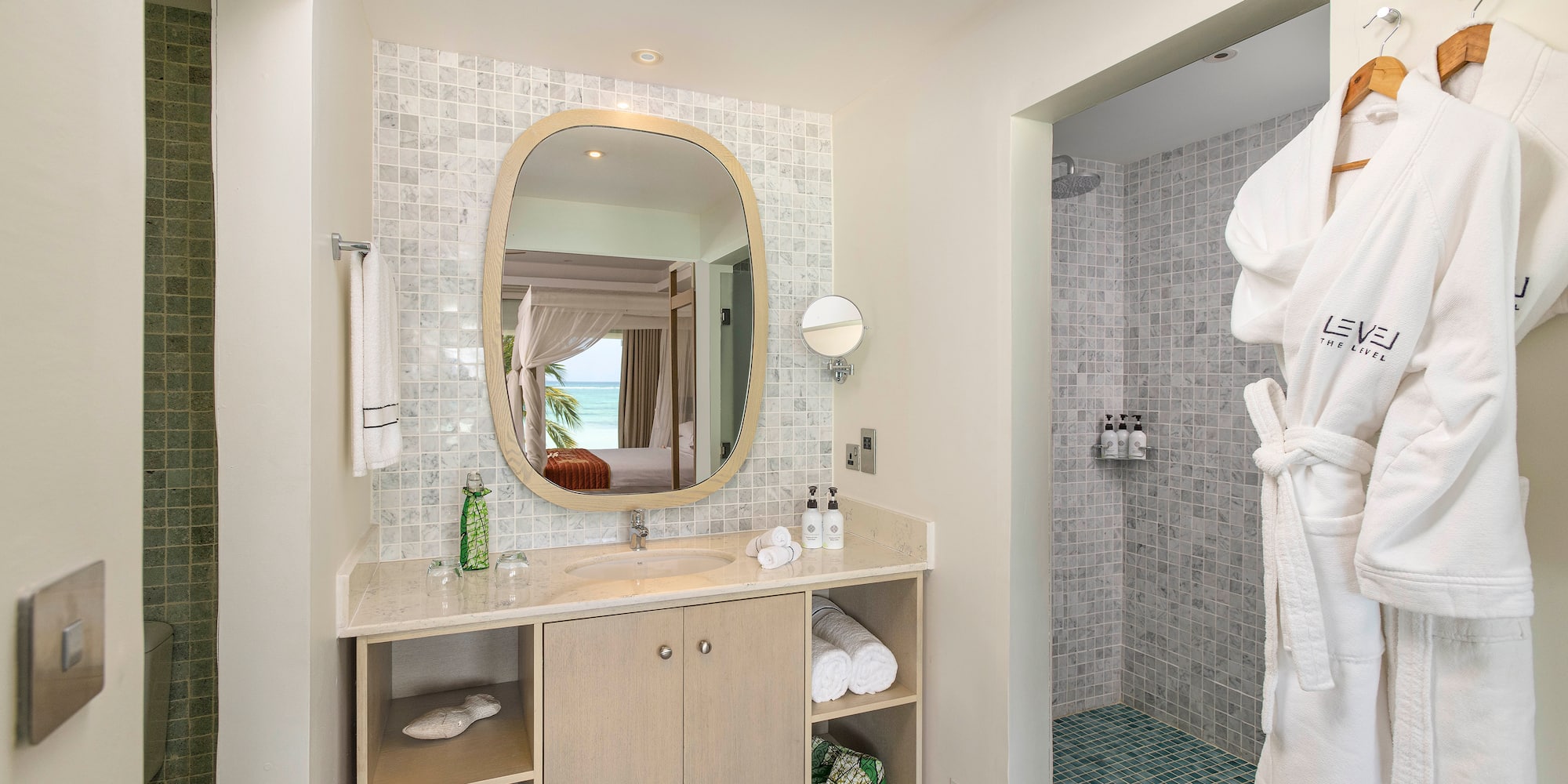 a bathroom with a mirror and a shower