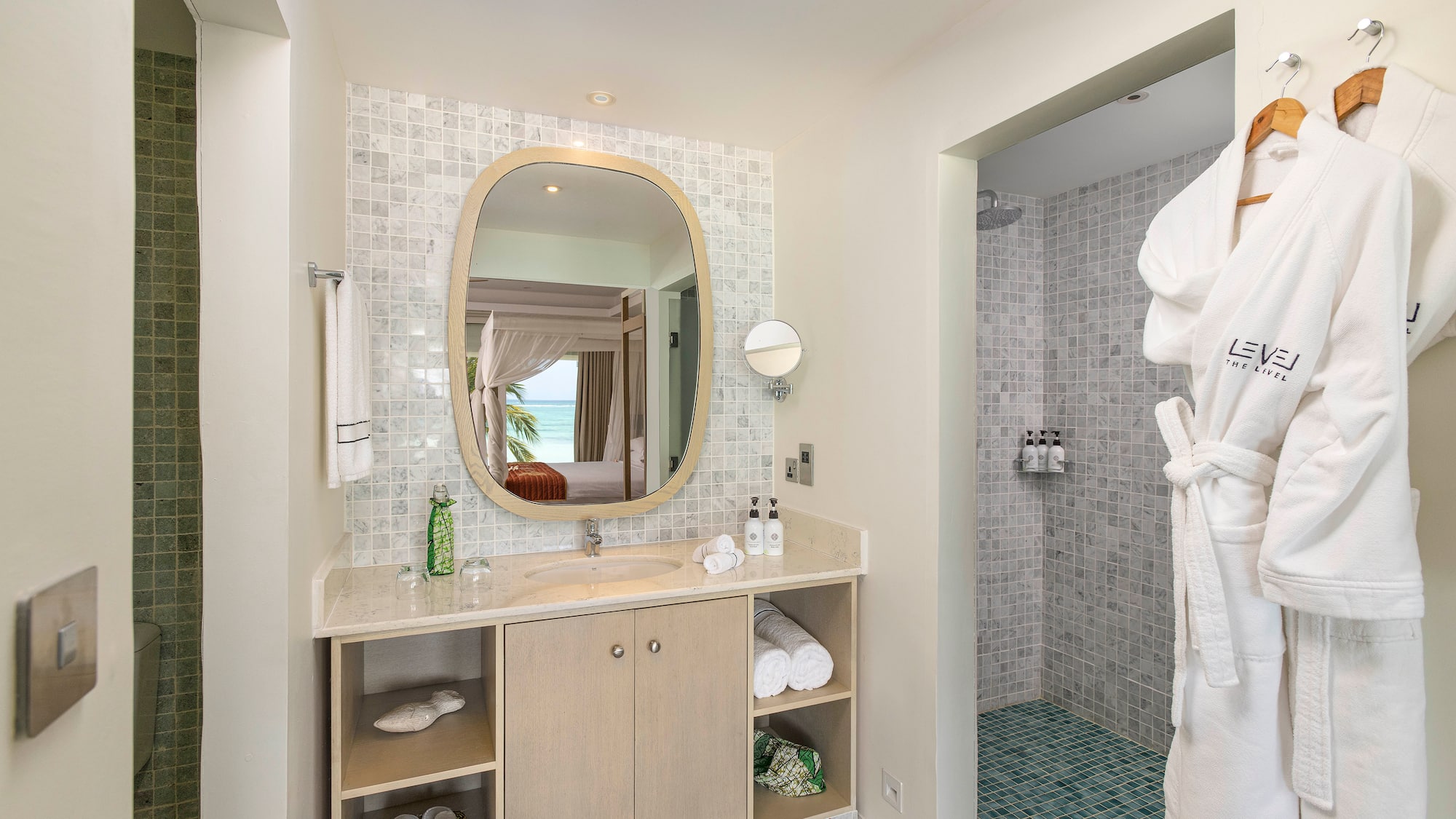 a bathroom with a mirror and a shower
