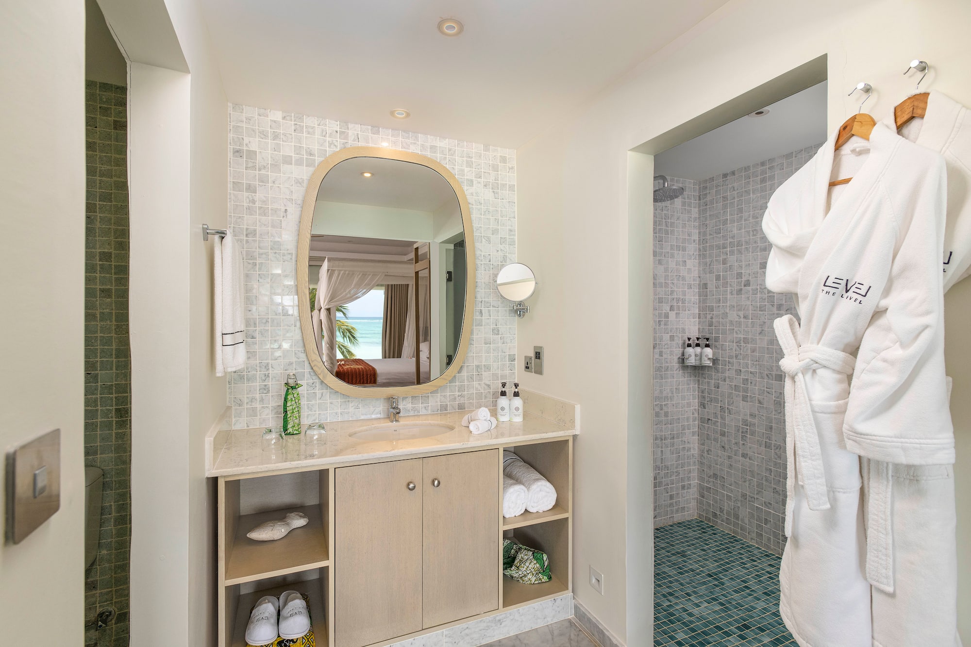 a bathroom with a mirror and a shower