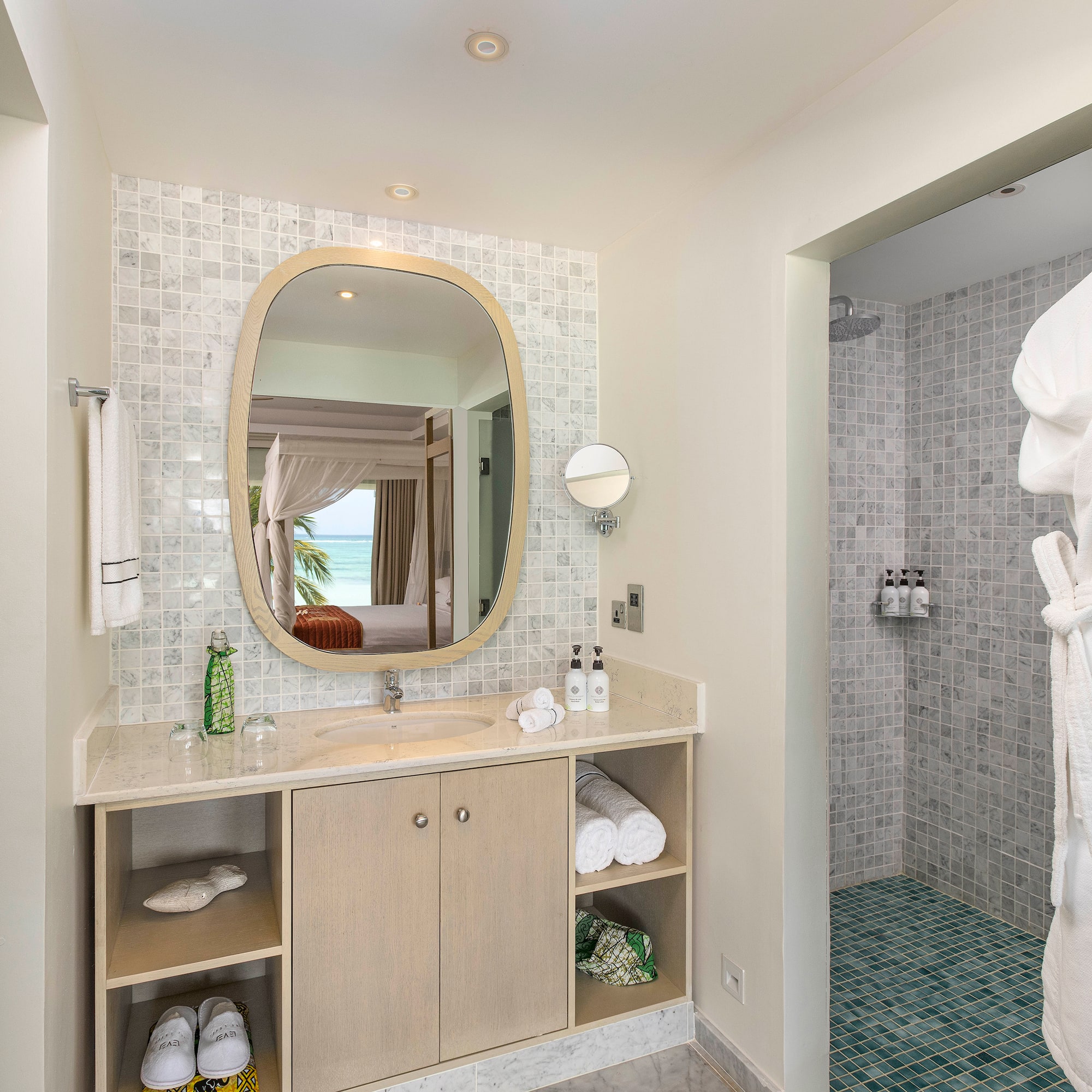 a bathroom with a mirror and a shower