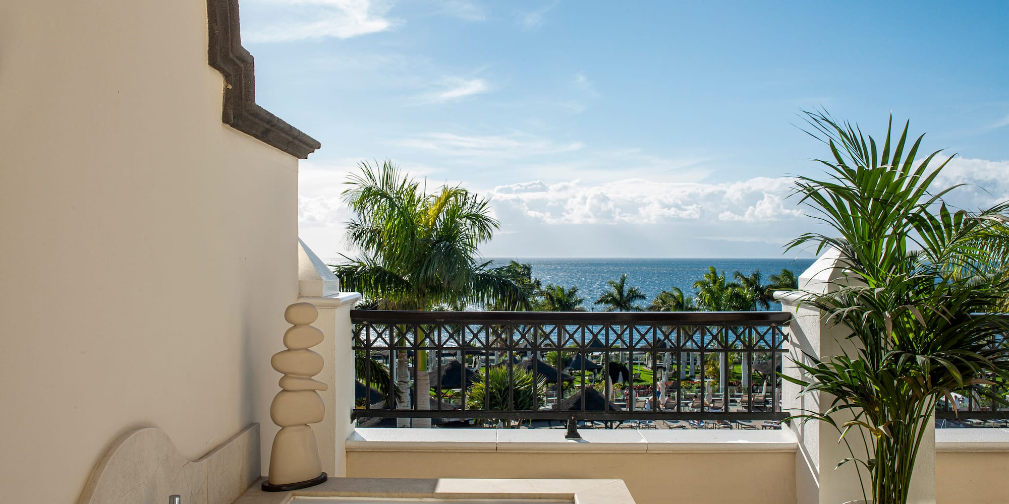 a bathtub on a balcony overlooking the ocean
