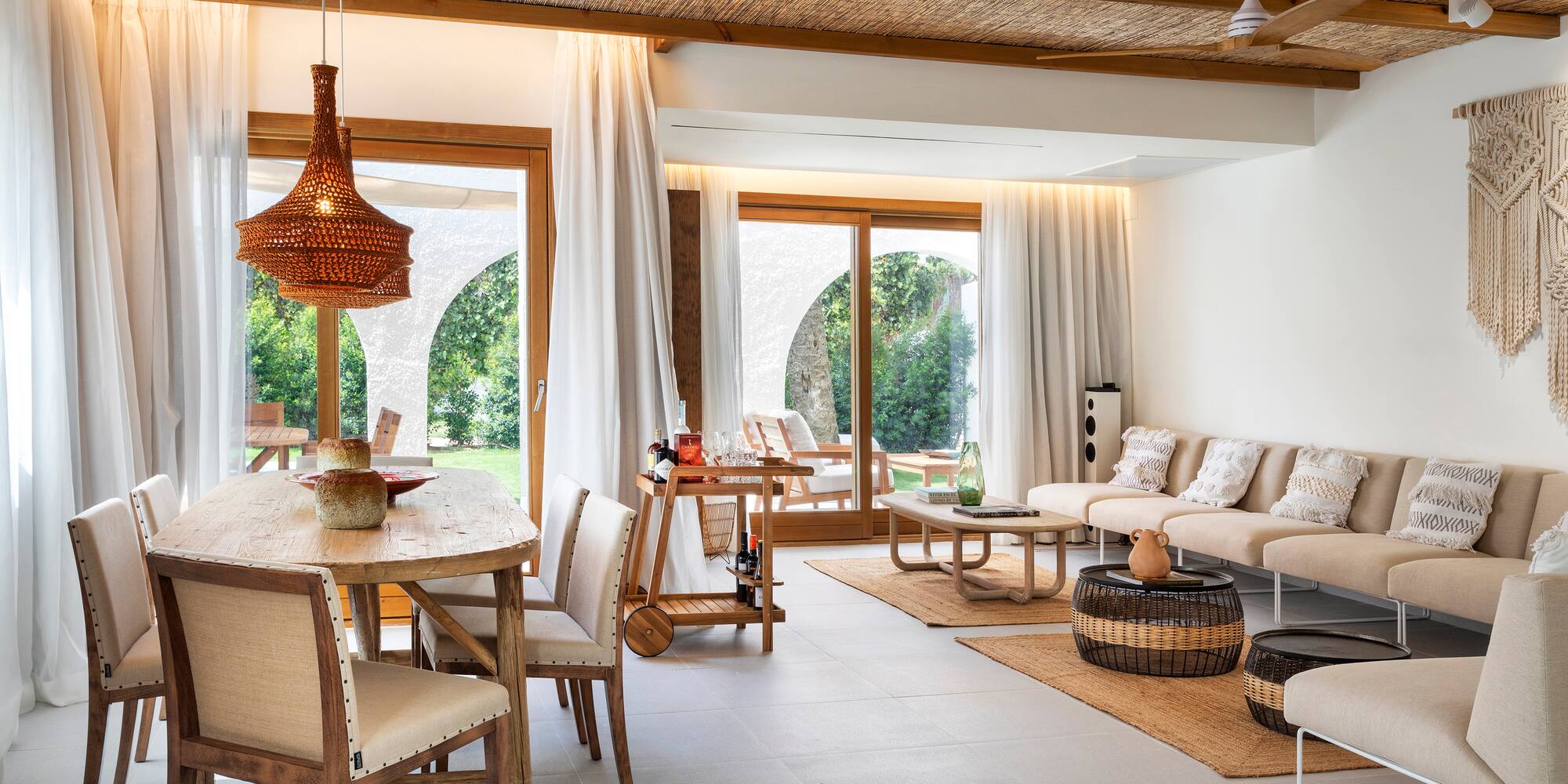 a living room with a table and chairs