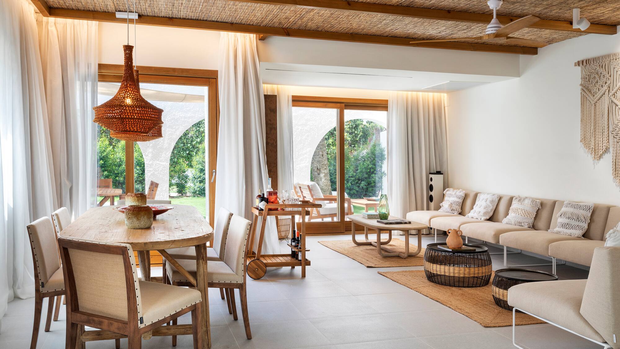 a living room with a table and chairs