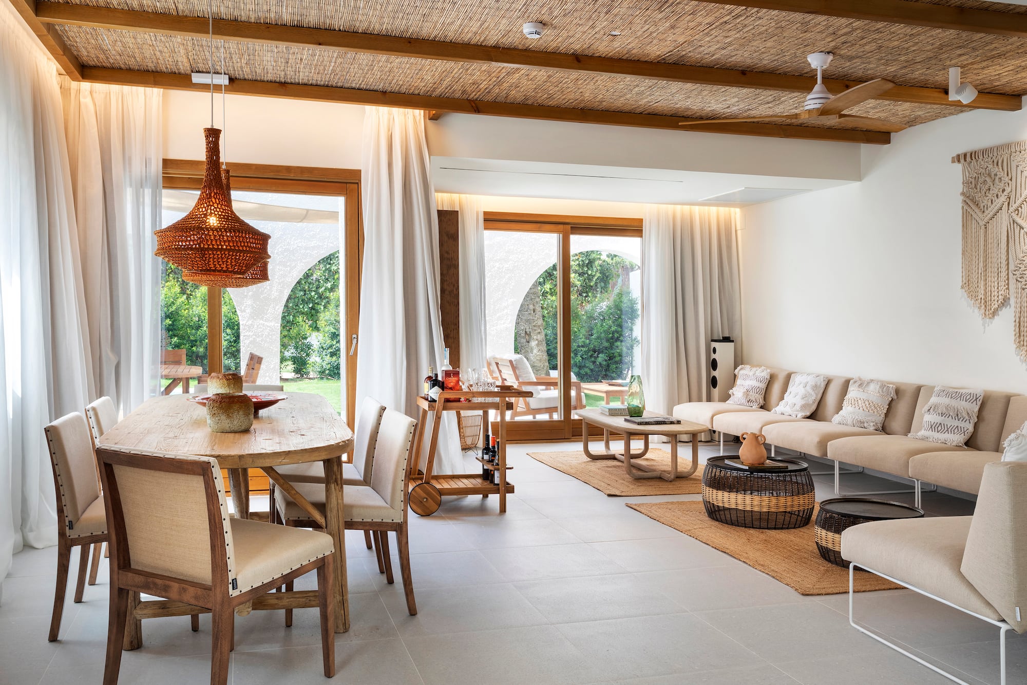 a living room with a table and chairs
