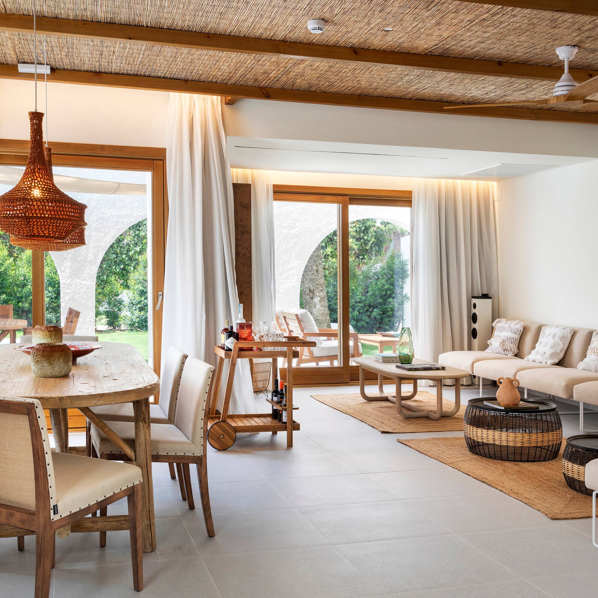 a living room with a table and chairs