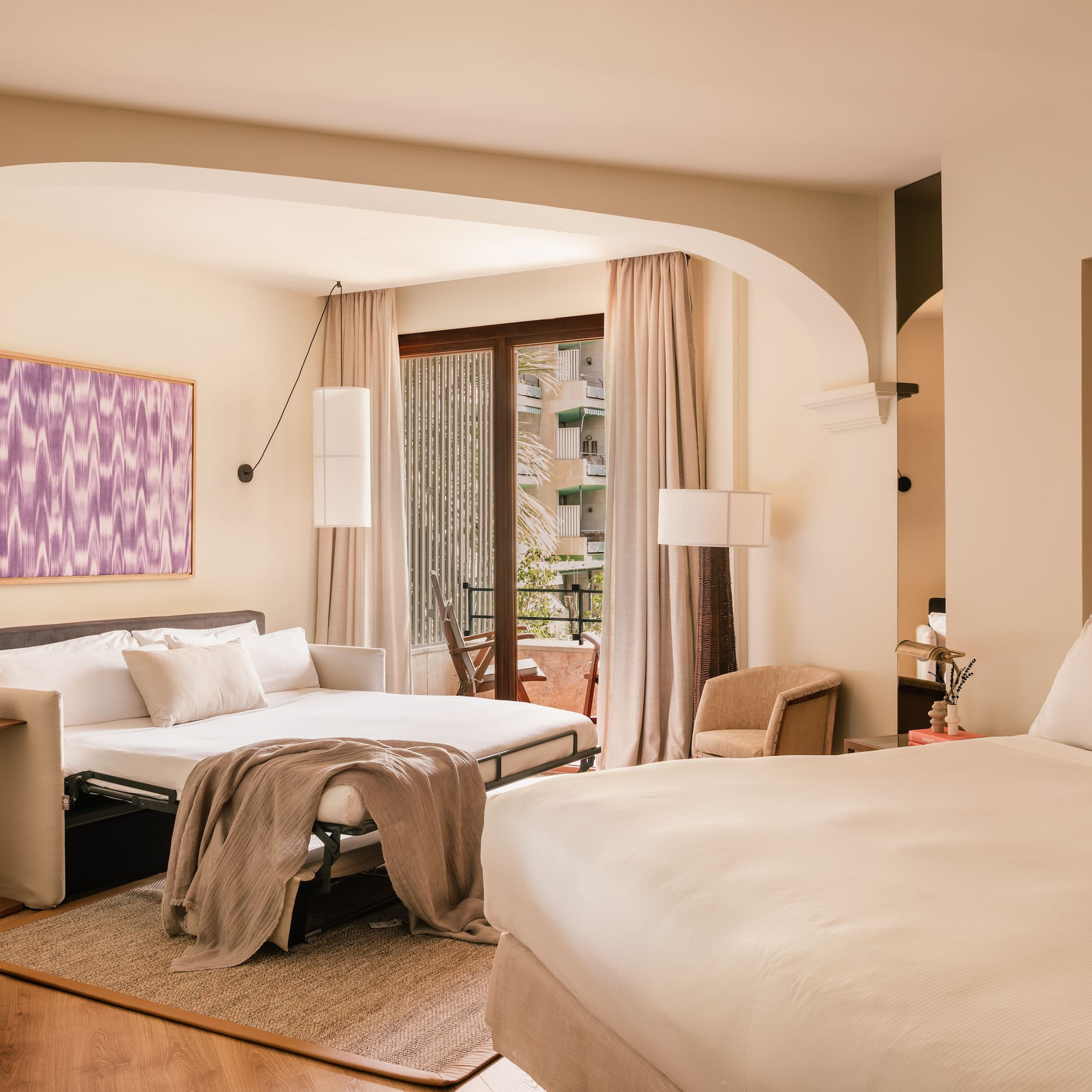 a bedroom with a bed and a table