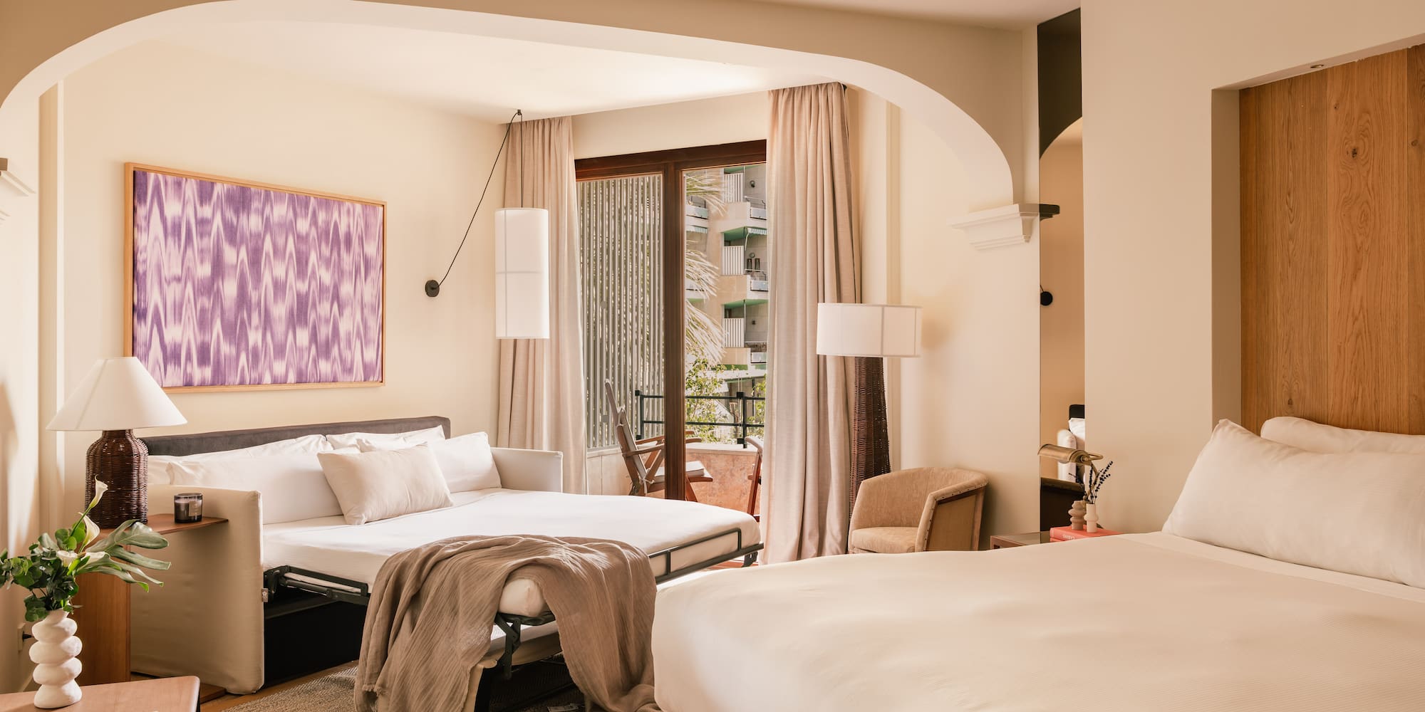 a bedroom with a bed and a table