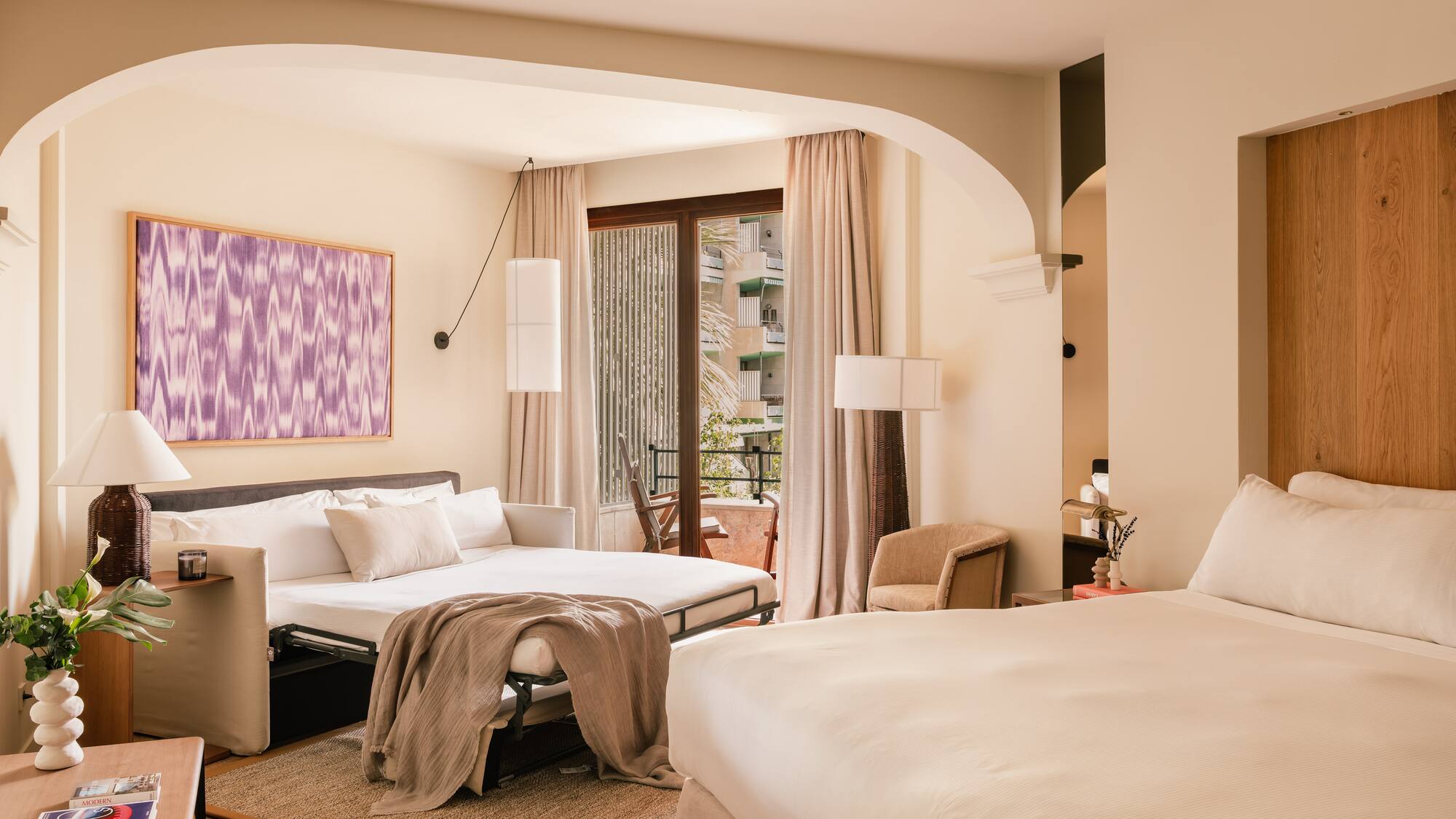 a bedroom with a bed and a table