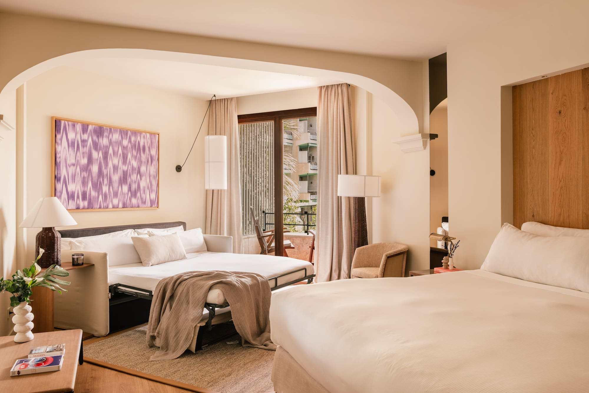 a bedroom with a bed and a table