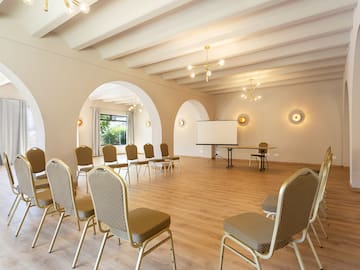 a room with chairs and a table