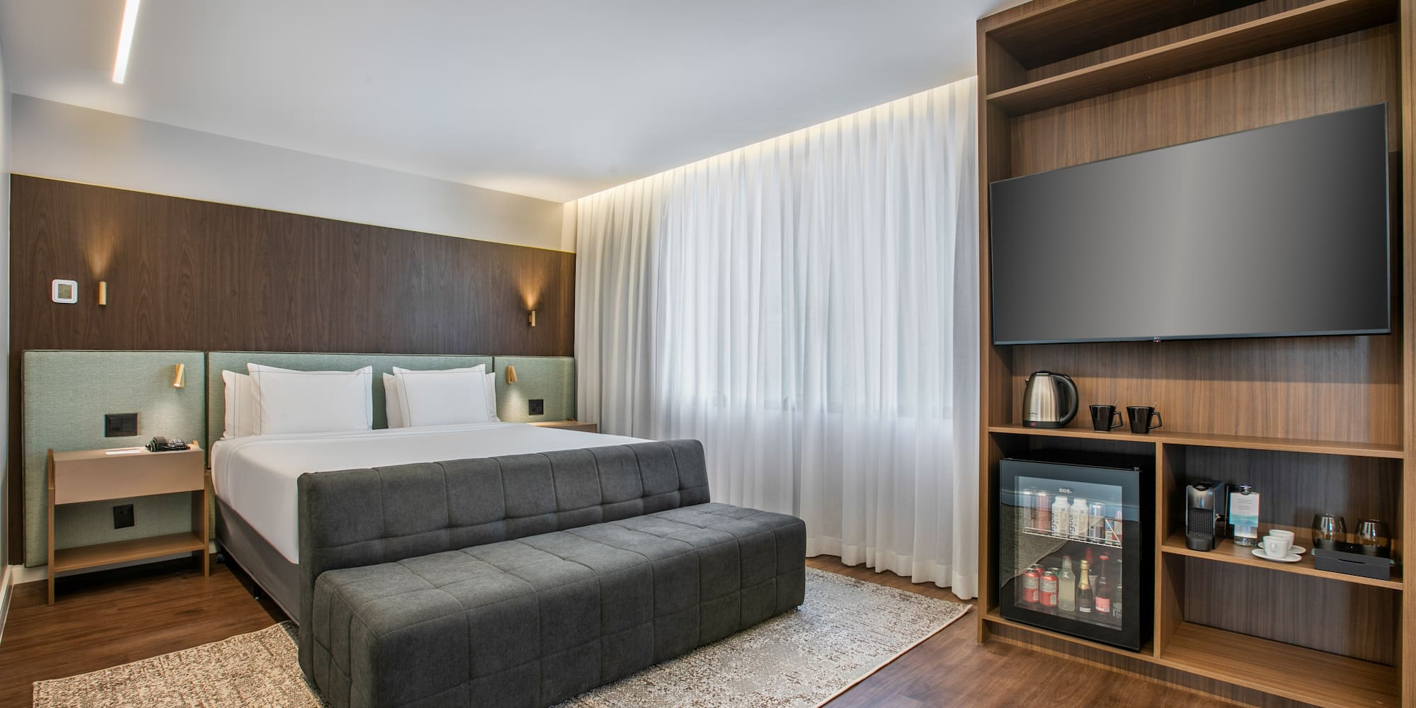 a room with a bed and a tv